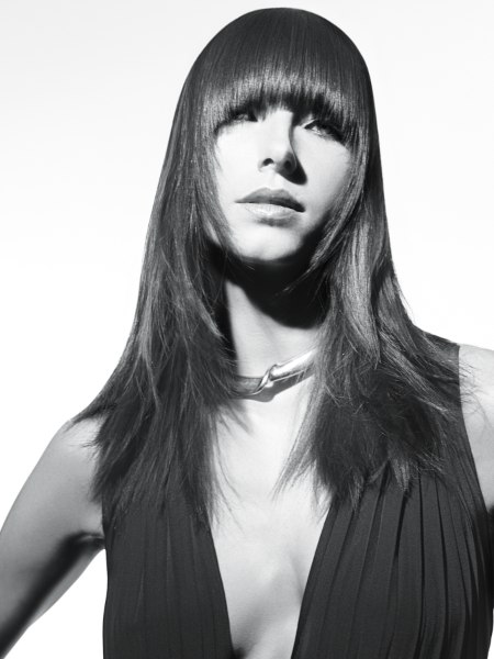 Long-haired cut with sleek thick bangs
