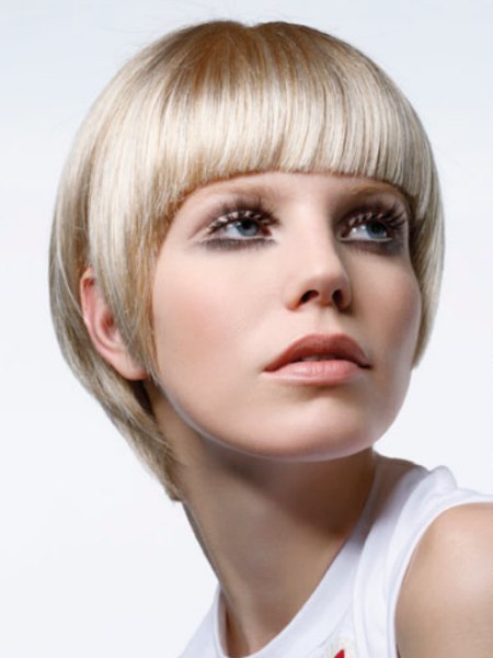 Short blonde 1960s haircut with a wide fringe
