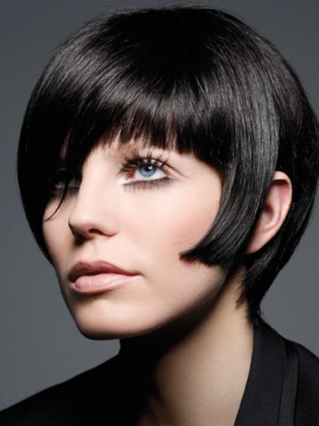 Short black hair with a snug fitting neck and retro influences