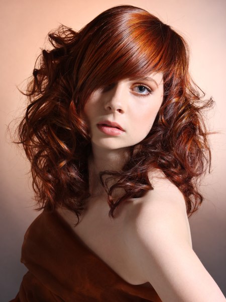 Feminine long hair with curls and a tapered fringe