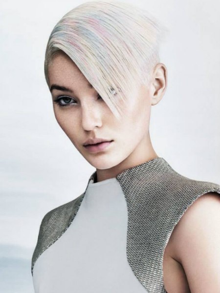 Short and sleek platinum blonde hair with pastel color accent