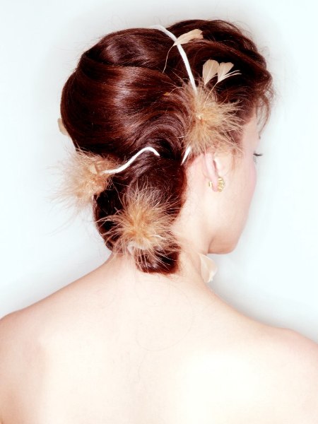 Up-do with a banana bun on the back of the head