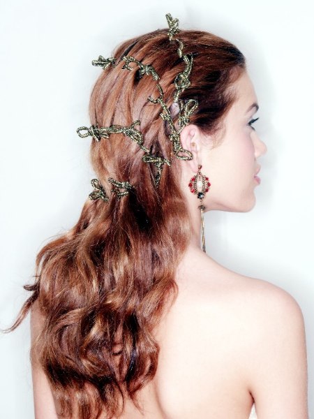 Long festive hairstyle with interwoven ribbons