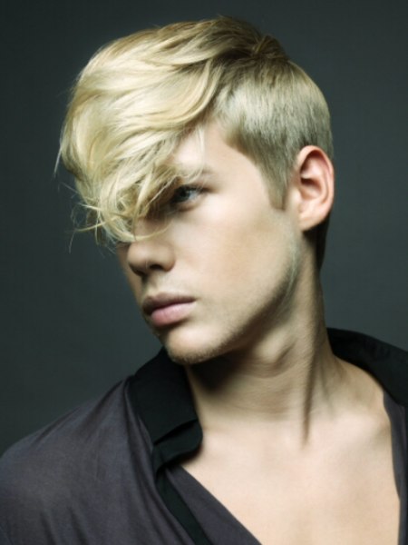 Men's hairstyle with blonde hair and the nape clipped up