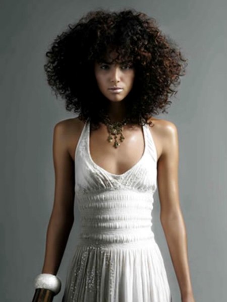Individually twisted curls to accentuate a Puerto Rican model's skin tone