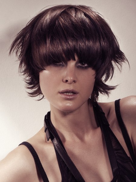 Short choppy haircut with a curved fringe