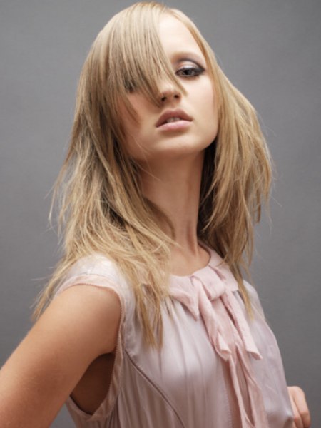 Long tapered hairstyle with nose-length bangs
