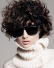curls and turtleneck sweater