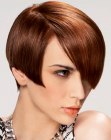 Short hairstyle with clean lines and long curved bangs