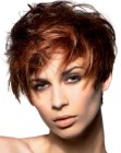 Short layered hair blown-out for volume and fullness