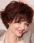 Short youthful hairstyle with a steeply graduated neck and volume