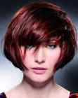 Modern short haircut with volume and diagonal styling