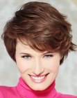 Short and fluffy hairstyle for brown hair with highlights