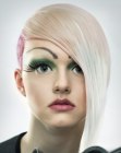 Blonde hair with buzzed sides and fuchsia color accents