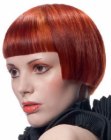 Red bob with sharp angles and very straight bangs