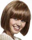 Classic just below the chin bob haircut with blunt bangs