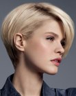 Smooth short hairstyle with a rounded back and long bangs