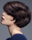 Short brunette hair with curves that follow the shape of the head