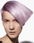 Lavender hair in a wedge shape cut with a shaved side