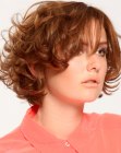Short above the collar hairstyle with curly layers