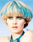 Blonde mushroom haircut with blue color splashes
