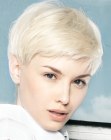 Very short platinum blonde pixie haircut with soft lines