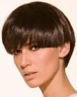 Classic short haircut with a longer back and a glossy surface