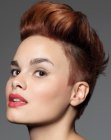 Very short haircut with shaved sides and a quiff for women