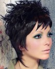 Black pixie cut with feathery strands that hug the neck