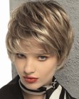 Longish pixie cut with hair that brushes the cheeks and eyebrows