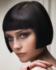 Sleek short bob with sharp lines and a glossy finish