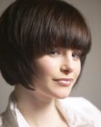 Classic chin-length bob with a rounded shape and curved bangs