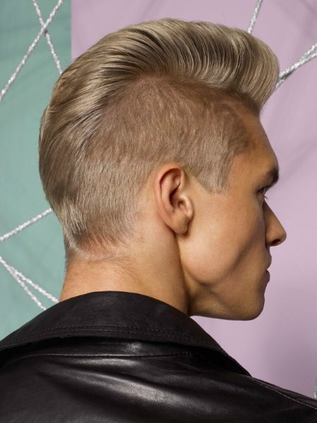 Punky male haircut with razor-short sides