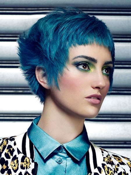 Short haircut with short bangs and blue hair coloring