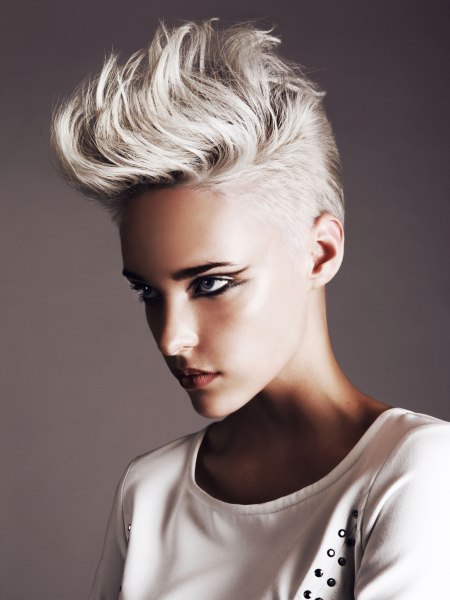 Feminine hairstyle with very short sides and longer top hair