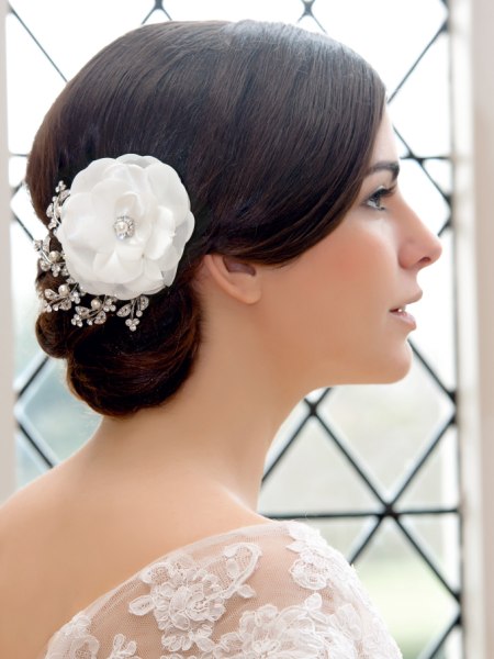Chignon and a hair accessory with a large flower