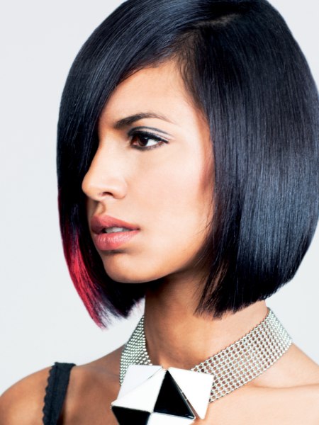 Black hair in a bob with a pink color accent