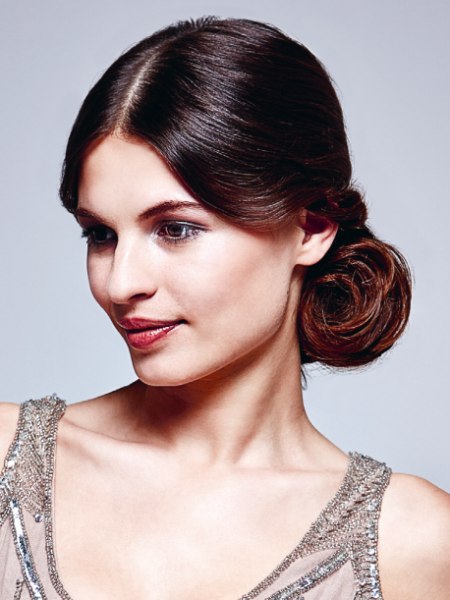 Updo with smoothed and rolled up hair