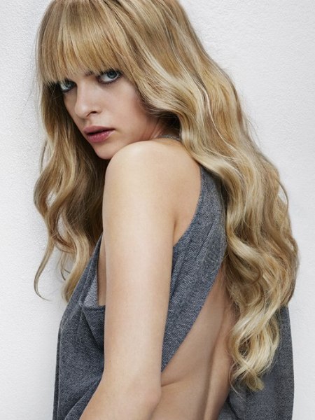 Long hairstyle with waves and bangs