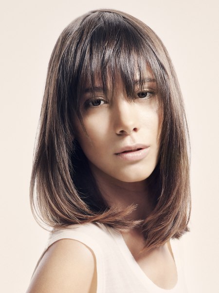 Youthful long sleek bob at shoulder length