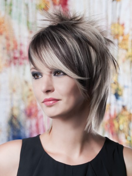 Modern medium length haircut with layers and spikes