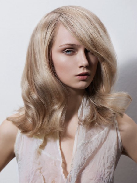 Modern long blonde hair with an overlapping partition