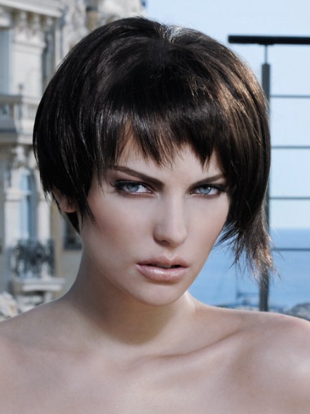 Irregular asymmetrical hairstyle with a deconstructed fringe