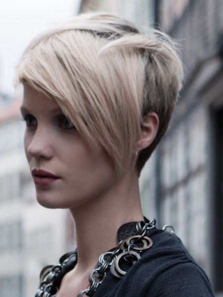 Short fashion haircut with a buzzed nape for women