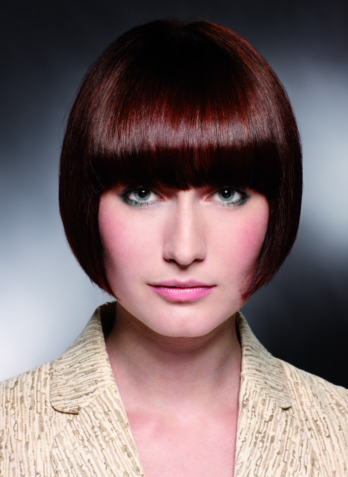 Short pageboy cut with bangs that cover the eyebrows
