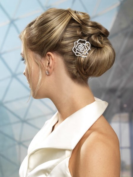 Festive updo with a bun and hairpins