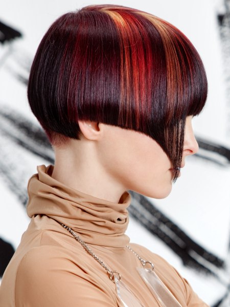 Modern hairstyle with a short nape and color streaks