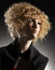 Layered wedge shape hair with a mass of curls
