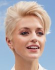 Classic women's hairstyle with short sides and a longer top