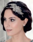 Retro Gatsby bob hairstyle with waves and a tiara
